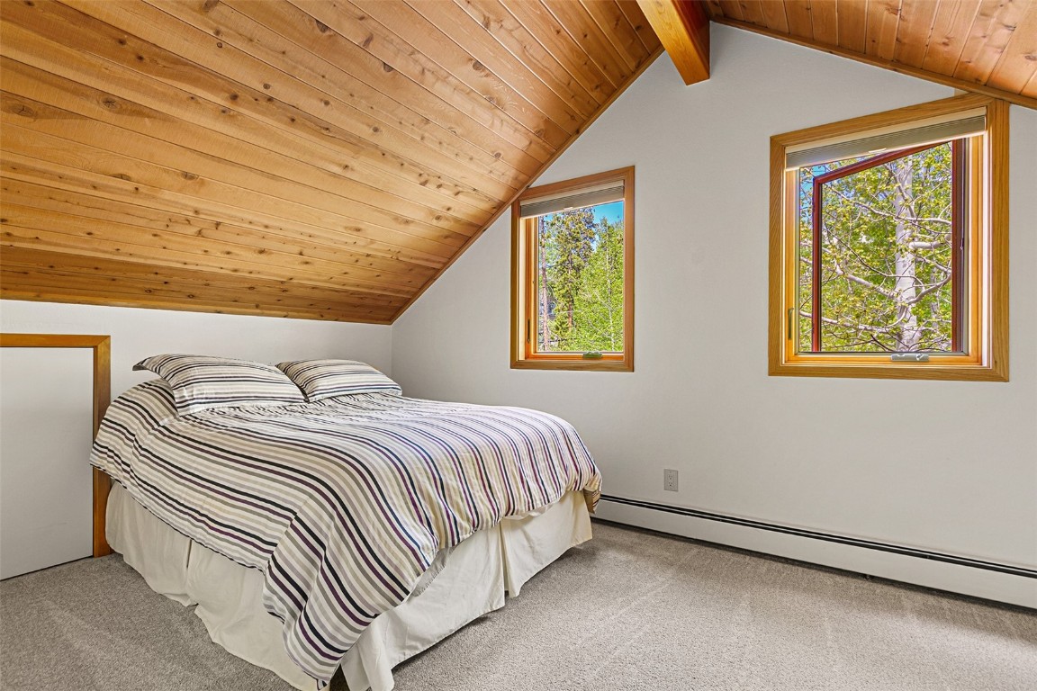 87 Spring Beauty Drive Silverthorne, CO 80498 - Photo 34 of 36 a bedroom with a bed and a window