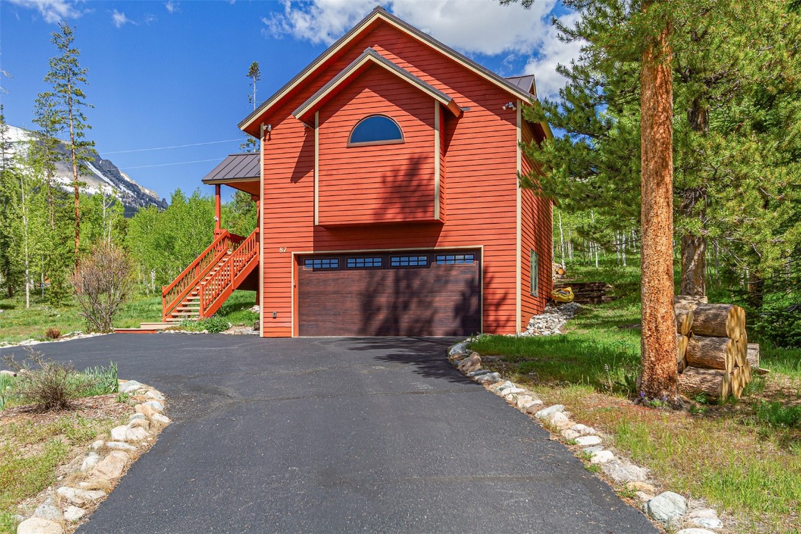 87 Spring Beauty Drive Silverthorne, CO 80498 - Photo 4 of 36 a front view of a house with a yard