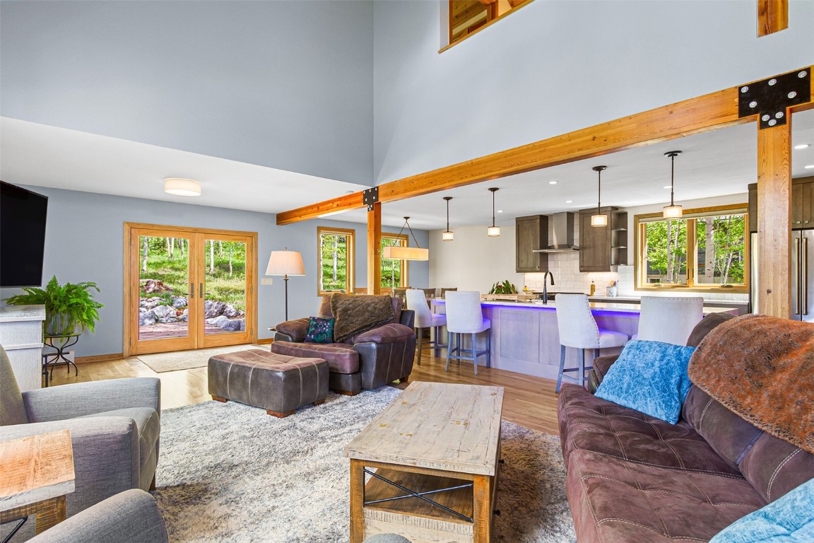 87 Spring Beauty Drive Silverthorne, CO 80498 - Photo 7 of 36 a living room with furniture kitchen view and large windows