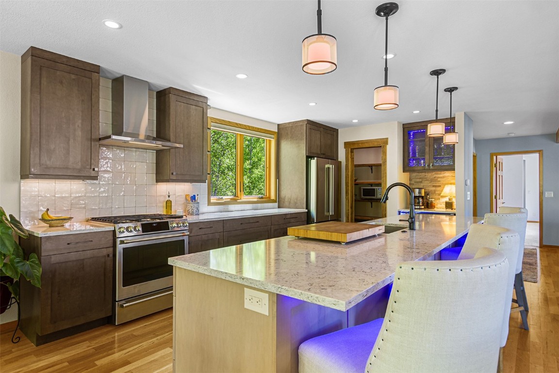 87 Spring Beauty Drive Silverthorne, CO 80498 - Photo 10 of 36 a kitchen with stainless steel appliances granite countertop a sink stove and refrigerator
