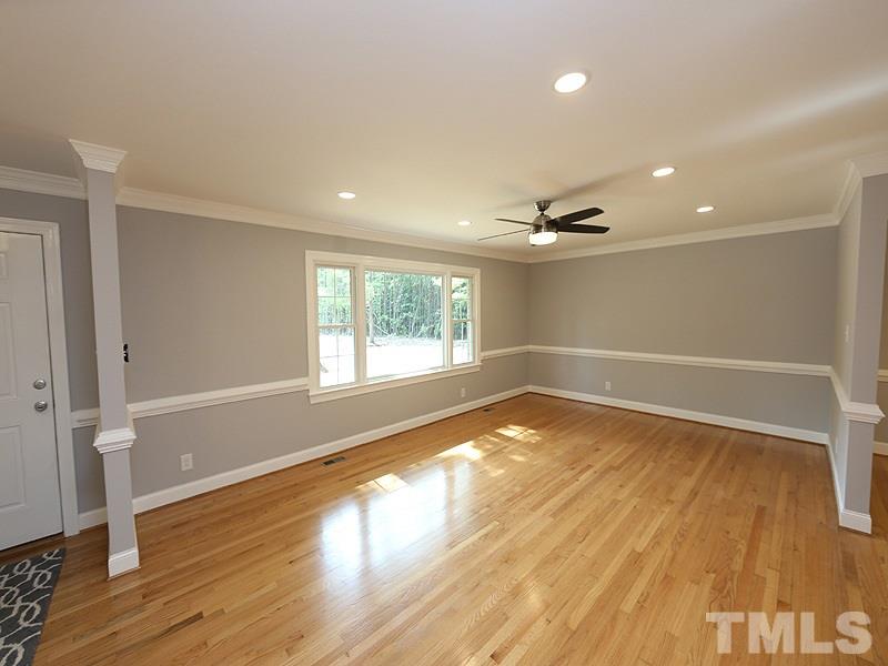 217 Chambers Road Rougemont, NC 27572 - Photo 2 of 19 an empty room with wooden floor and windows