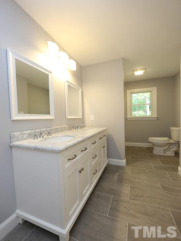 217 Chambers Road Rougemont, NC 27572 - Photo 14 of 19 a bathroom with a granite countertop sink and a mirror