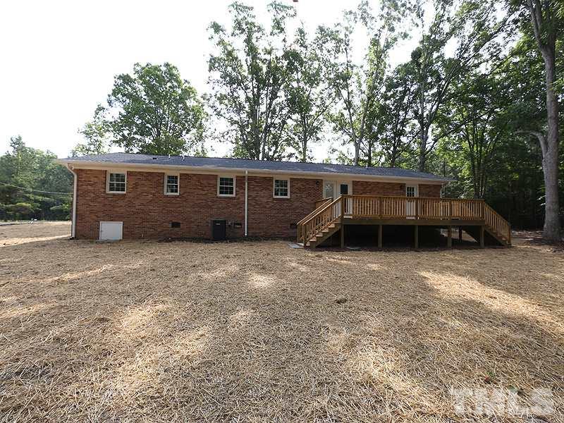 217 Chambers Road Rougemont, NC 27572 - Photo 16 of 19 a view of a house with a backyard and a sink