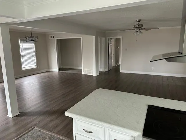 a view of an empty room with a window