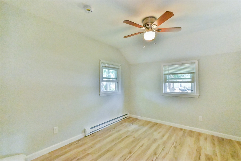 27 Lakeview Road Webster, MA 01570 - Photo 24 of 26 a view of empty room with wooden floor and fan