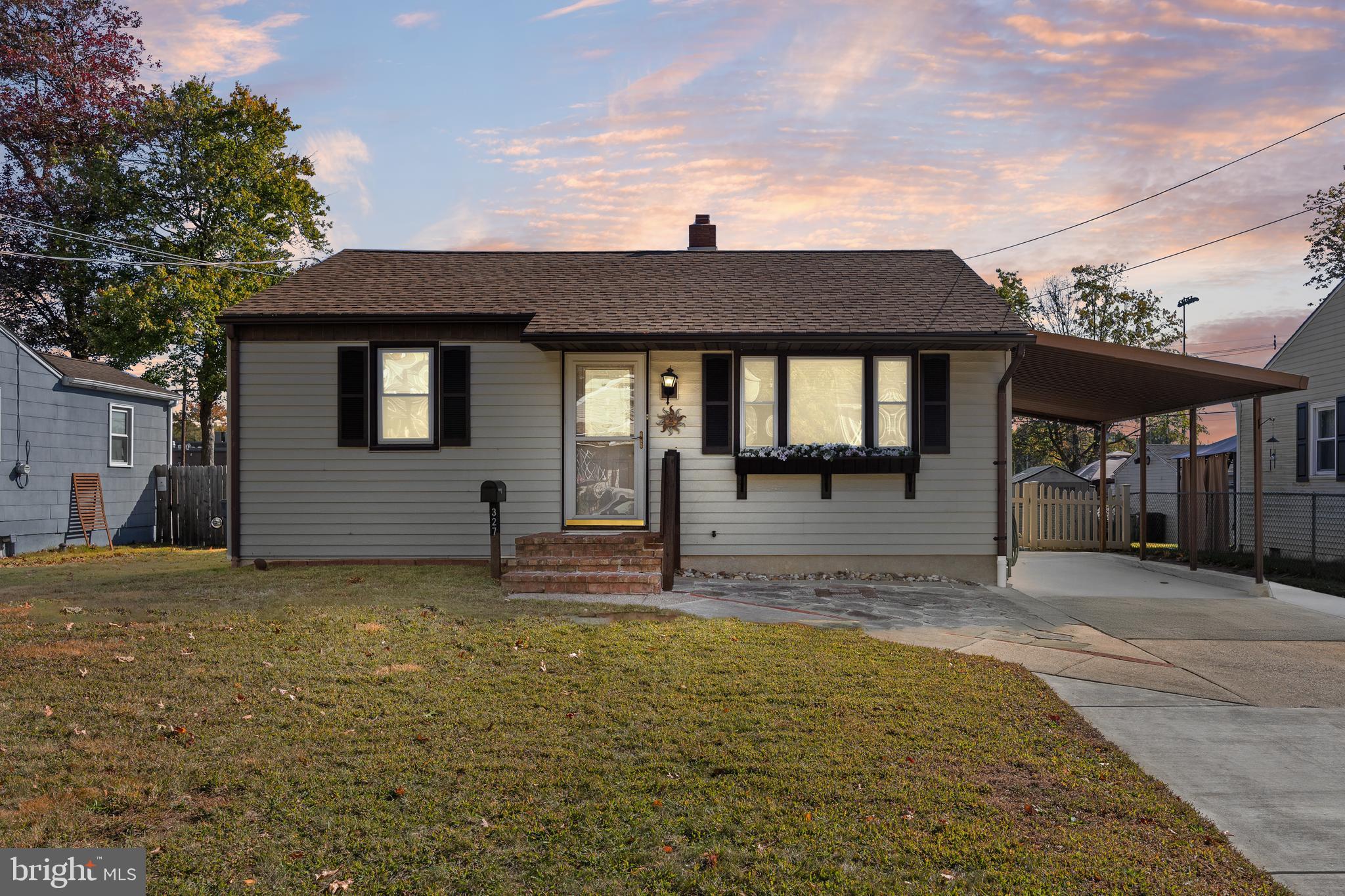 a view of a house with backyard and porch