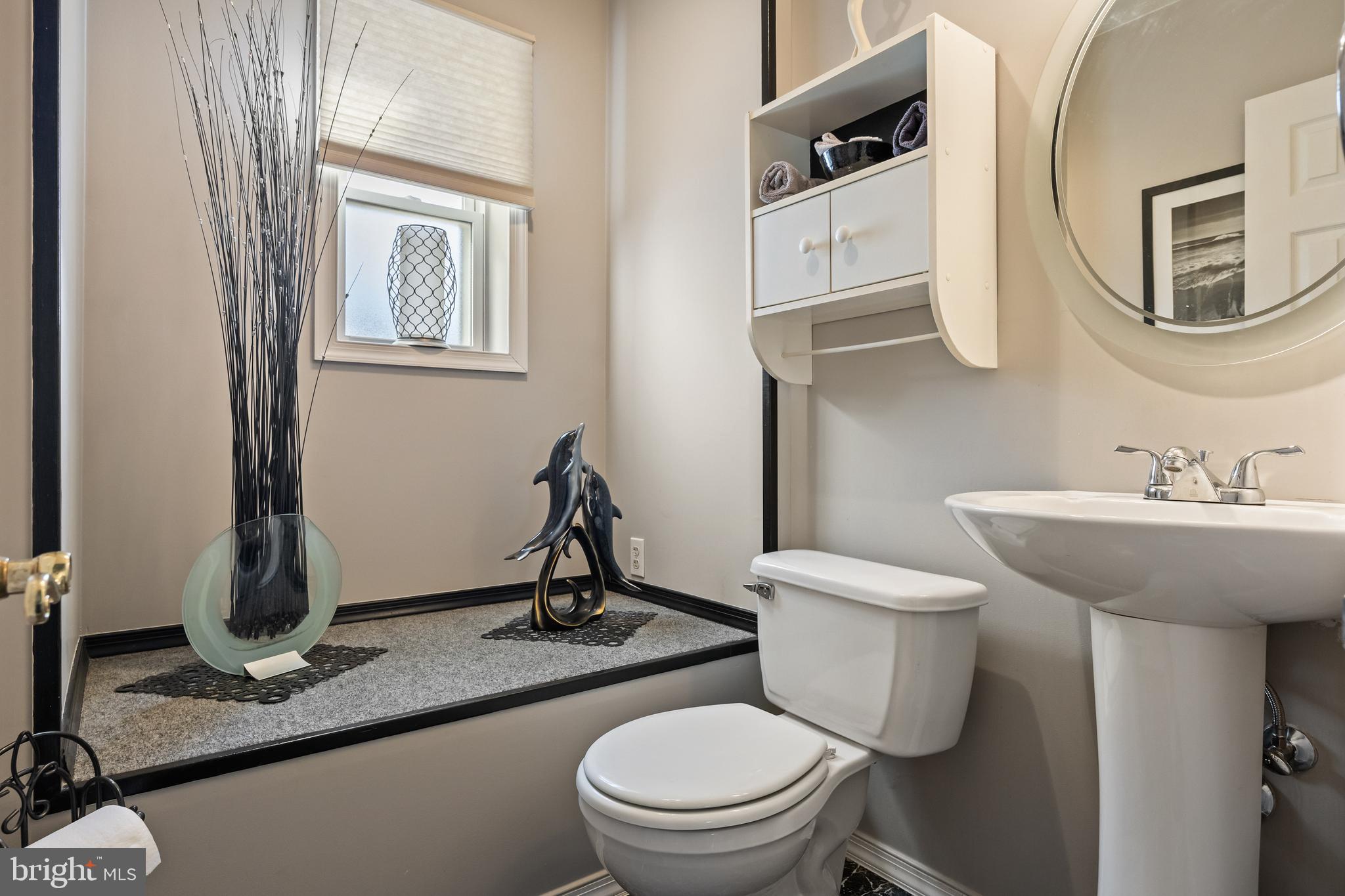 327 South Coles Avenue Maple Shade, NJ 08052 - Photo 15 of 22 a bathroom with a toilet a sink and mirror