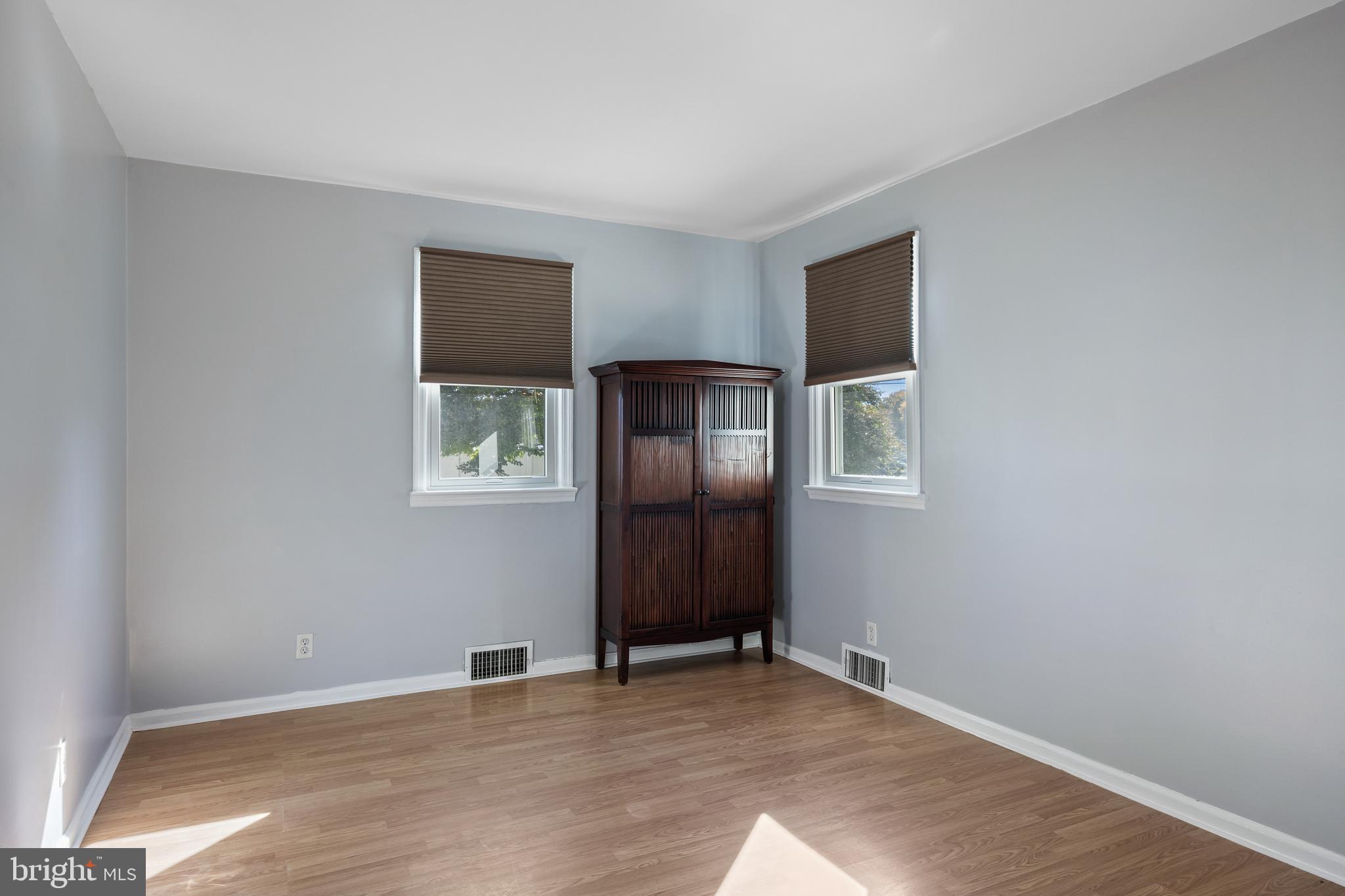 327 South Coles Avenue Maple Shade, NJ 08052 - Photo 17 of 22 a view of an empty room with wooden floor and windows