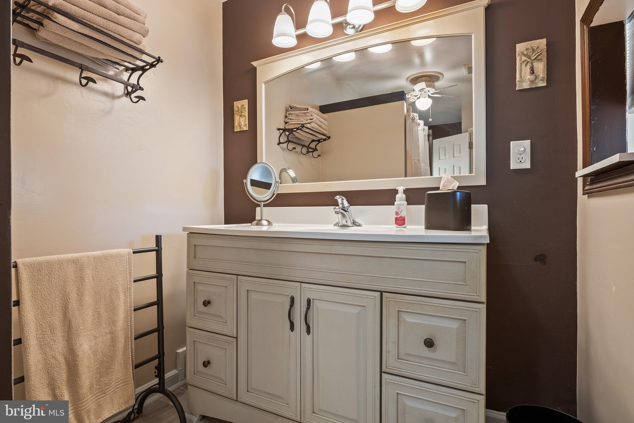 327 South Coles Avenue Maple Shade, NJ 08052 - Photo 19 of 22 a bathroom with a sink and a mirror