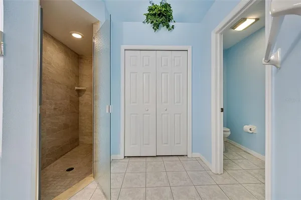 a bathroom with a shower and a sink