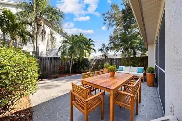 a view of a dinning table and chairs in the patio