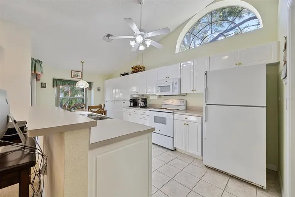 a kitchen with appliances cabinets and a sink