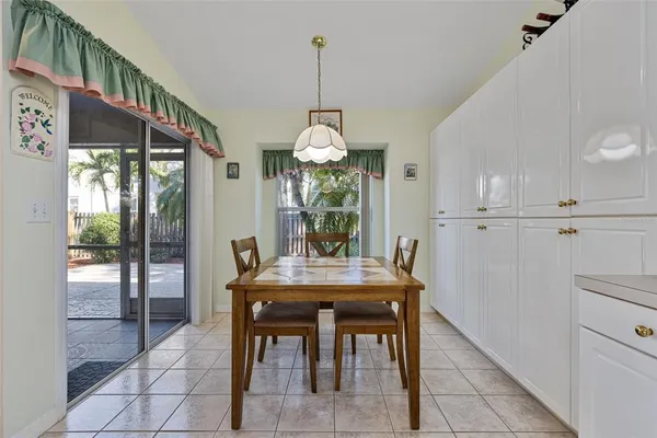 a dining room filled with furniture and window