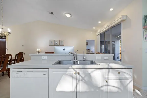 a kitchen with stainless steel appliances granite countertop a sink and cabinets