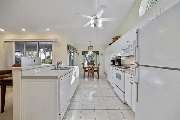 a kitchen with a sink stainless steel appliances and cabinets