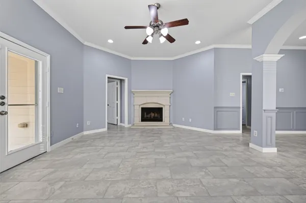 a view of an empty room with a fireplace