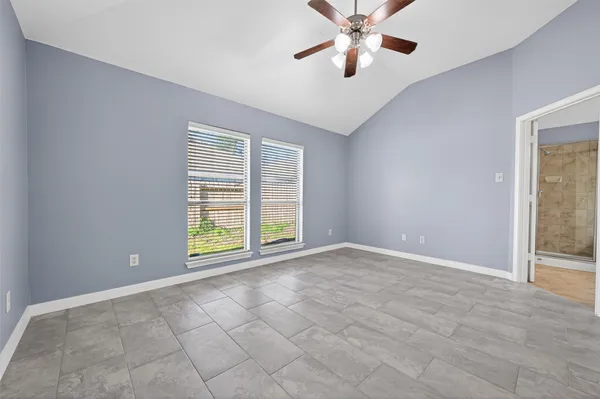 a view of an empty room with a window