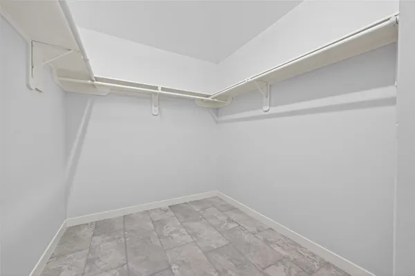 a view of an empty walk in closet
