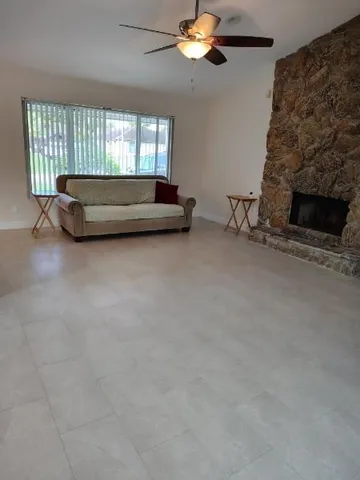 a living room with a fireplace furniture and a fireplace