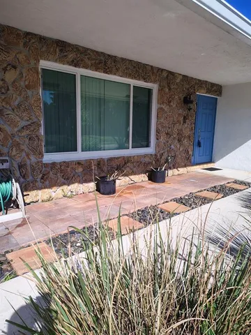 a view of a entryway door front of house