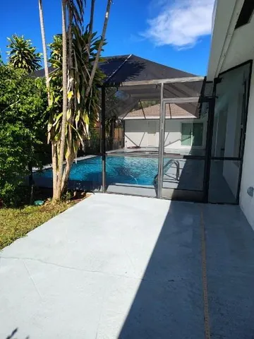a view of backyard with a small cabin