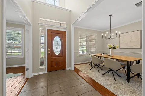 a view of a livingroom with furniture window and wooden floor