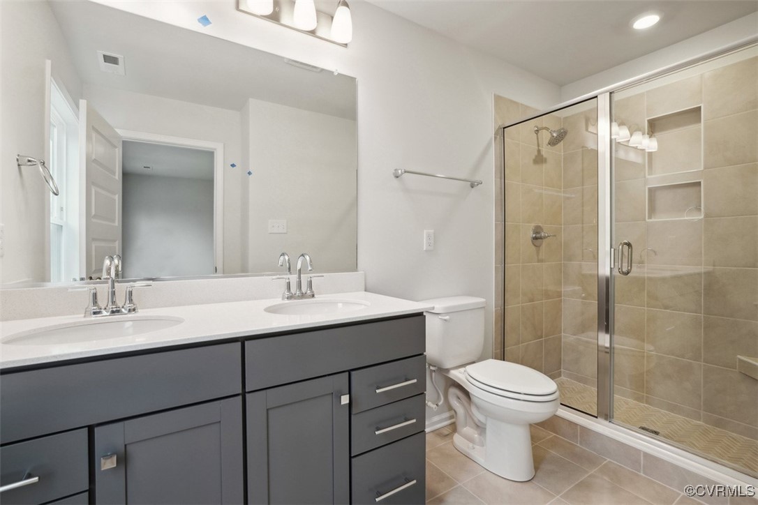 206 That Way Midlothian, VA 23114 - Photo 12 of 25 a bathroom with a sink toilet a mirror and shower