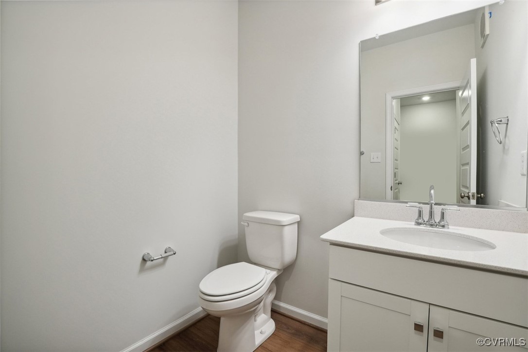 206 That Way Midlothian, VA 23114 - Photo 20 of 25 a bathroom with a toilet sink and mirror