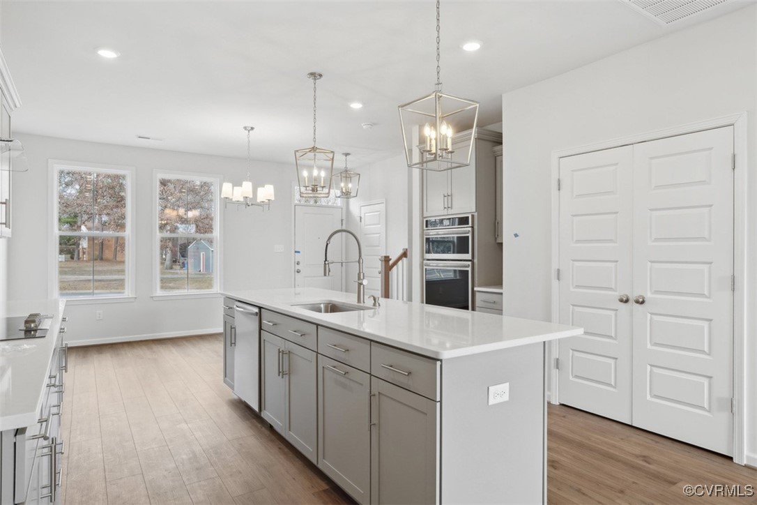 206 That Way Midlothian, VA 23114 - Photo 4 of 25 a kitchen with a sink a center island a counter space and a window
