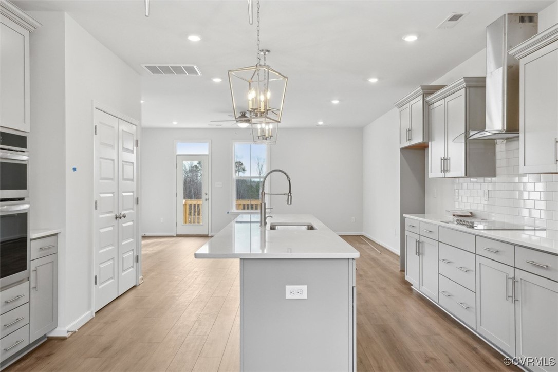 206 That Way Midlothian, VA 23114 - Photo 5 of 25 a kitchen with kitchen island a sink stainless steel appliances and cabinets