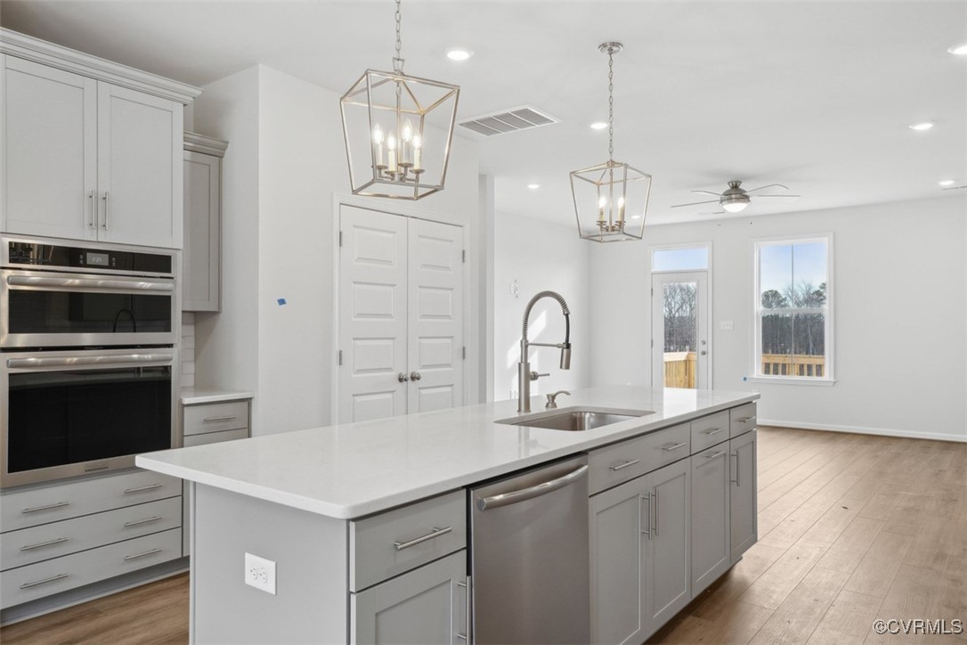206 That Way Midlothian, VA 23114 - Photo 6 of 25 a kitchen with sink cabinets and stainless steel appliances