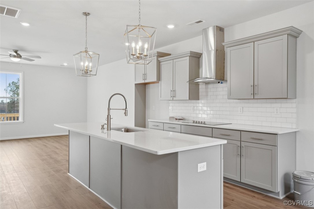 206 That Way Midlothian, VA 23114 - Photo 7 of 25 a kitchen with kitchen island stainless steel appliances a sink stove and cabinets