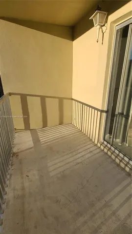 a view of balcony with wooden floor