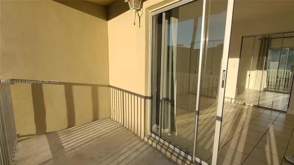 a view of balcony with furniture