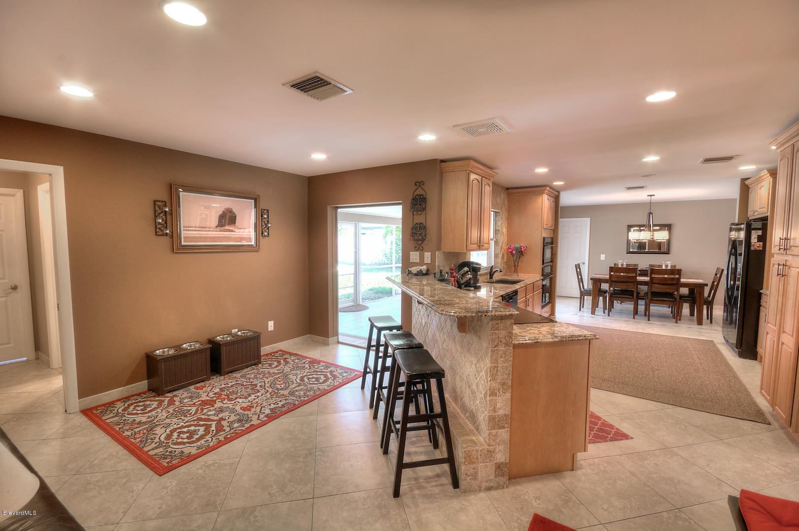 687 Caribbean Road Satellite Beach, FL 32937 - Photo 14 of 32 familyroom-kitchen.jpg