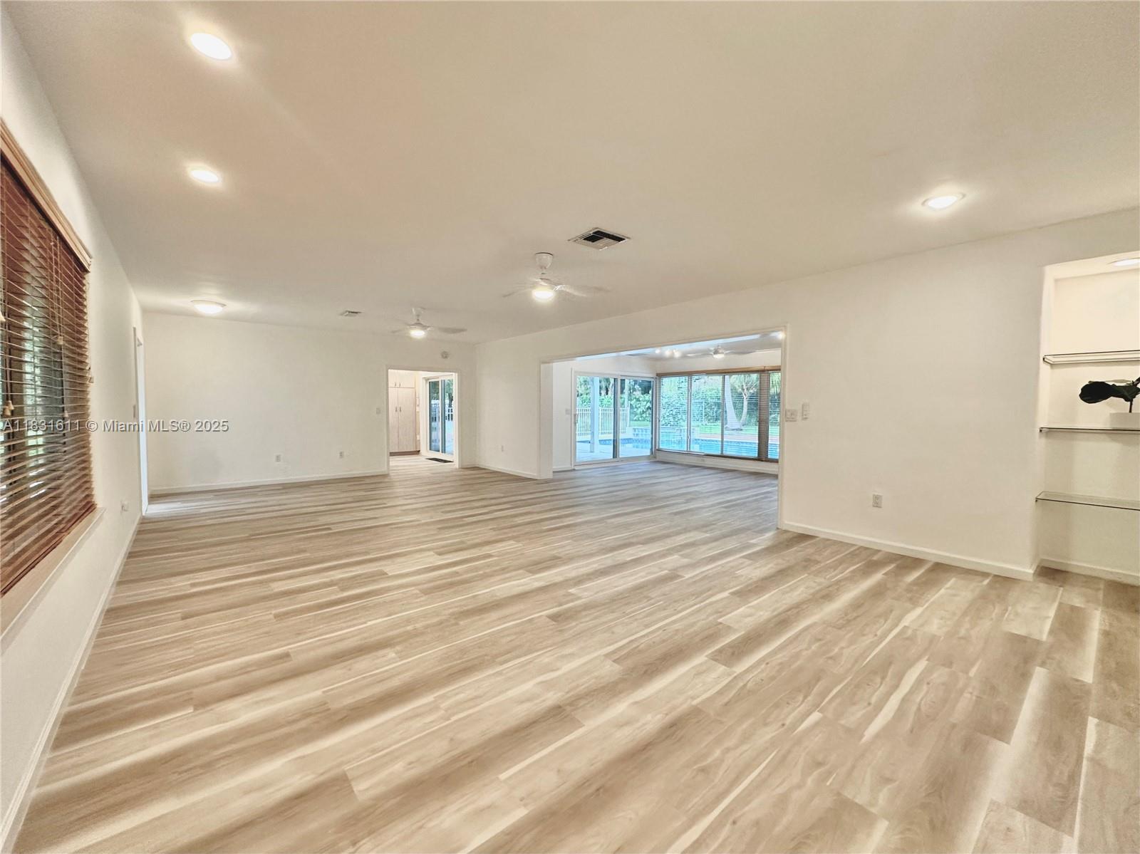 12501 Moss Ranch Road Pinecrest, FL 33156 - Photo 4 of 14 a view of an empty room