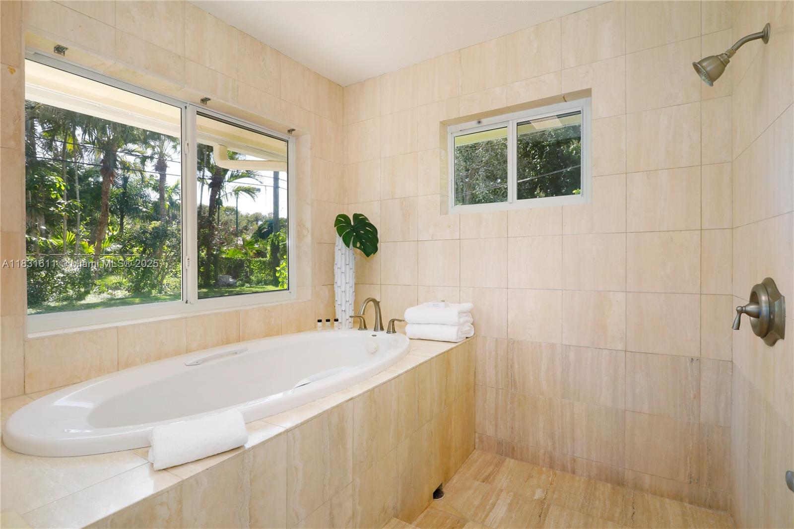 12501 Moss Ranch Road Pinecrest, FL 33156 - Photo 8 of 14 a bath tub sitting next to a window