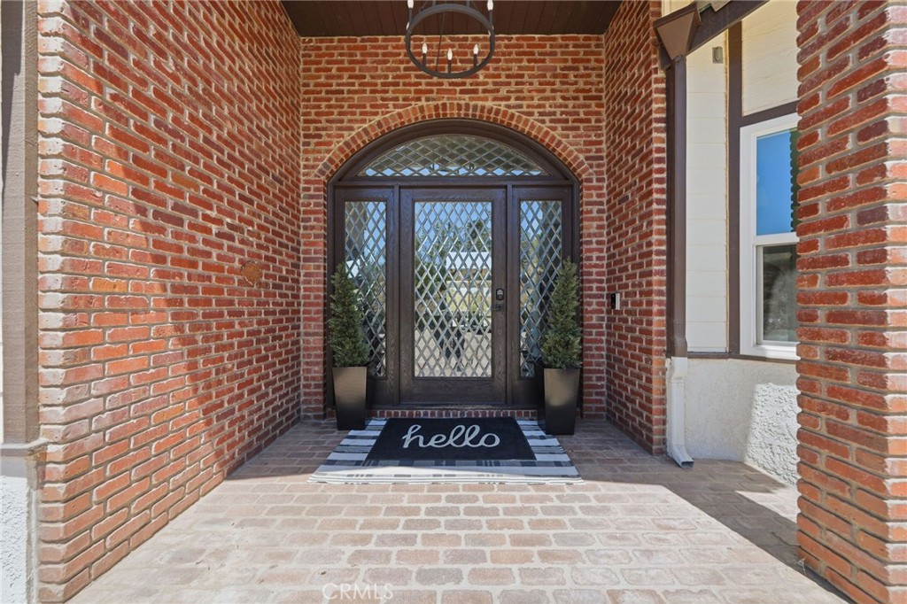 41110 Los Ranchos Circle Temecula, CA 92592 - Photo 8 of 77 a front view of a house with a garden