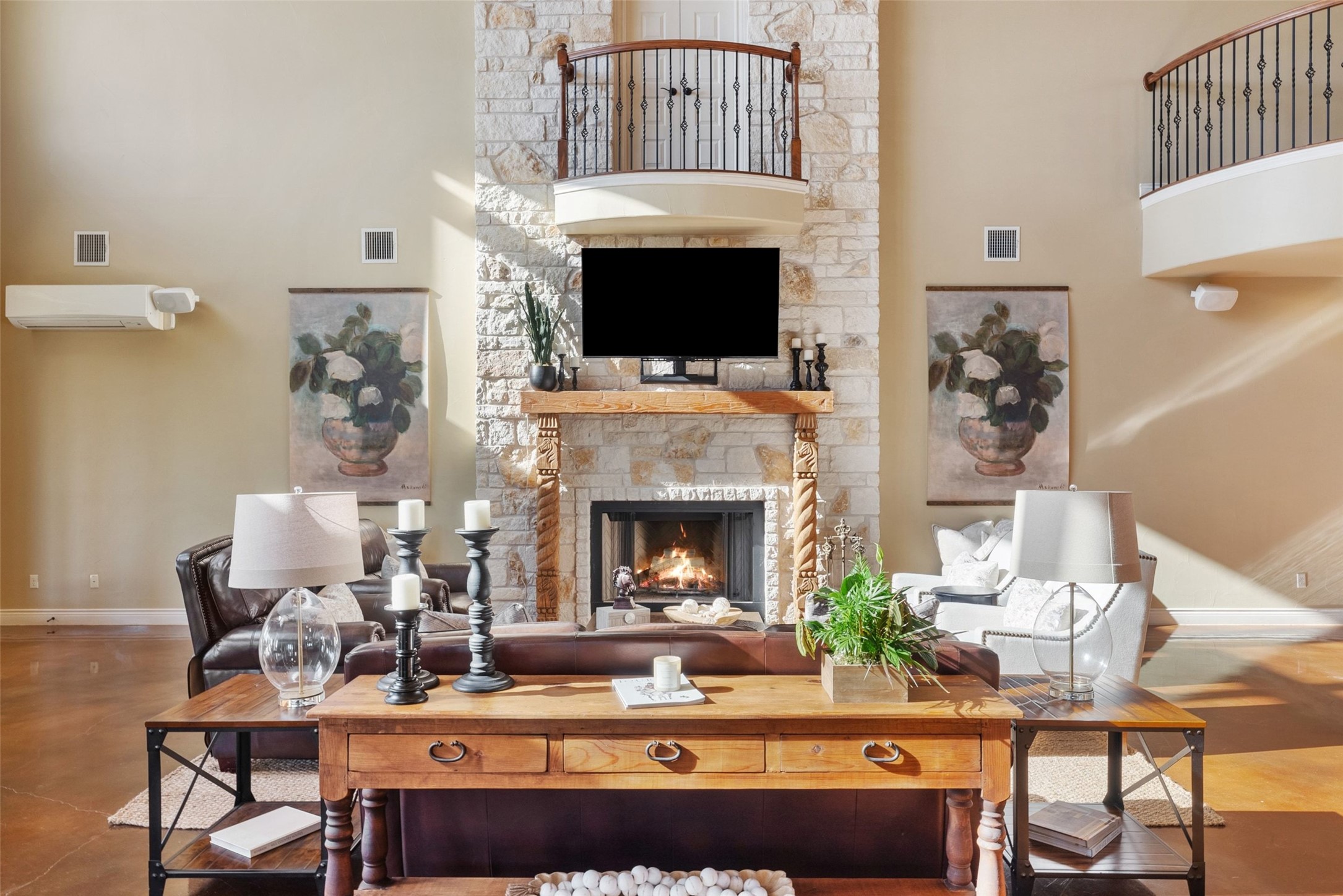 7220 Creek Road Dripping Springs, TX 78620 - Photo 10 of 40 Living room featuring a high ceiling and a fireplace.