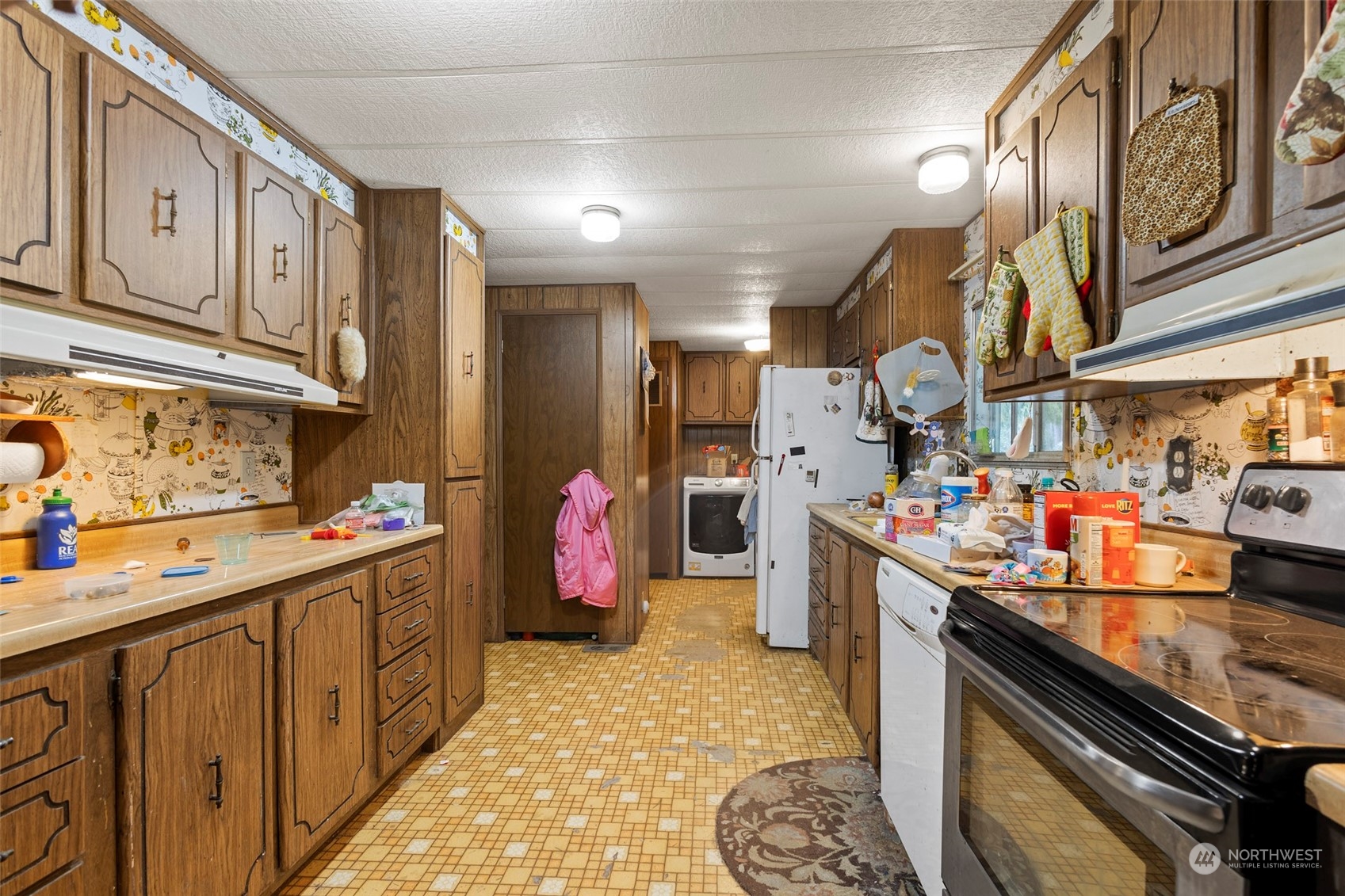 8848 Valley View Road Custer, WA 98240 - Photo 3 of 9 a kitchen with lots of counter top space and wooden floor