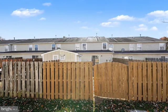 a view of a balcony with wooden floor and city view
