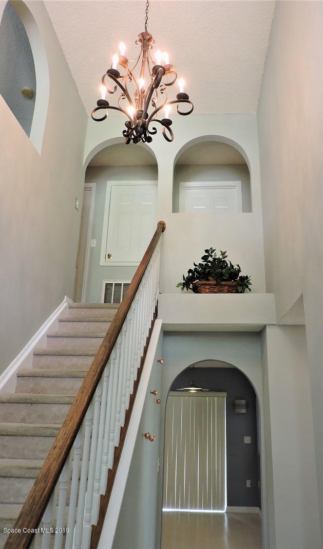 2196 Spring Creek Circle Palm Bay, FL 32905 - Photo 3 of 34 Entry/Stairs to 2nd Flr.
