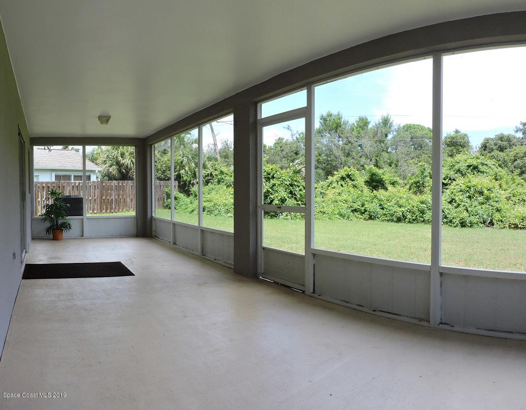 2196 Spring Creek Circle Palm Bay, FL 32905 - Photo 22 of 34 Screened porch