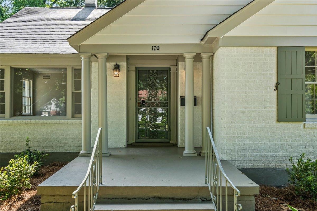 170 South Greer Street Memphis, TN 38111 - Photo 14 of 35 Covered front entry featuring a screen door, decorative columns, and a fixed exterior light fixture