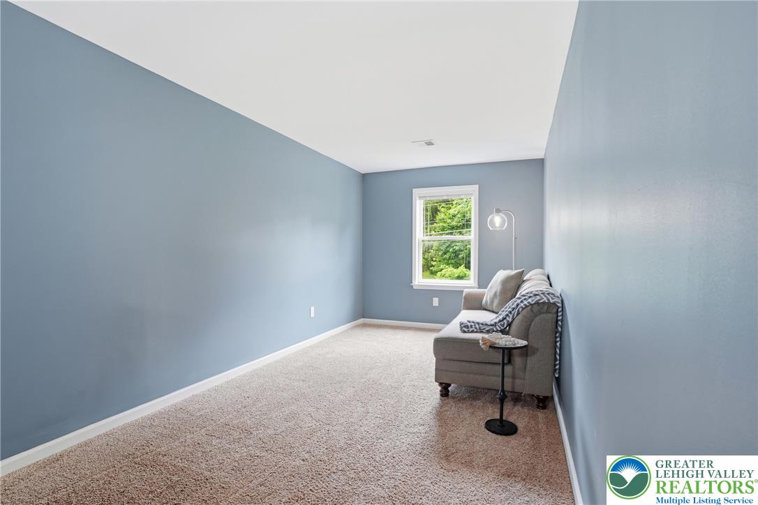 1212 Miller Road Wind Gap, PA 18091 - Photo 33 of 72 A quiet space with soft carpet, bathed in natural light from the window.