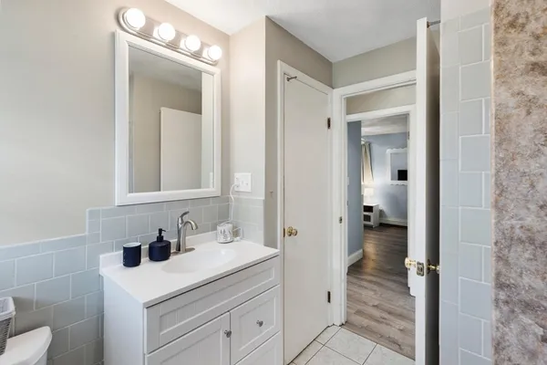 a bathroom with a sink and a mirror