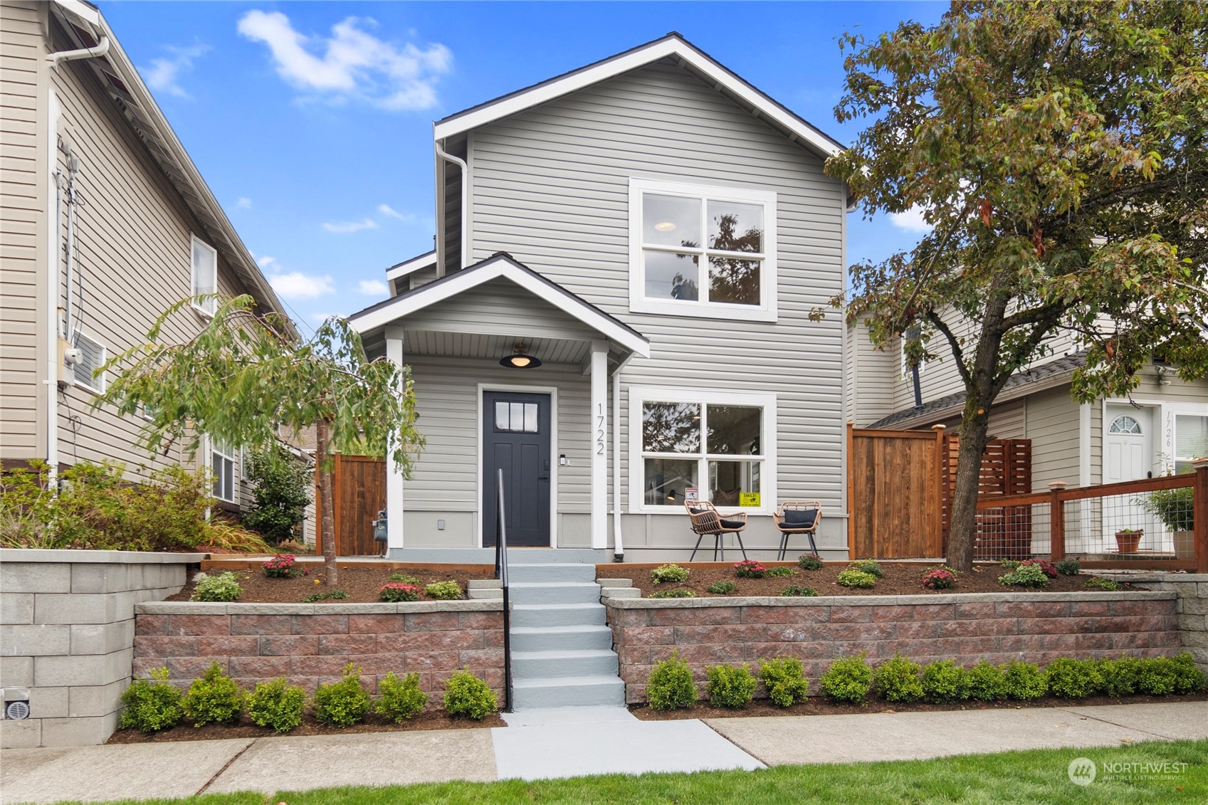 a front view of a house with garage