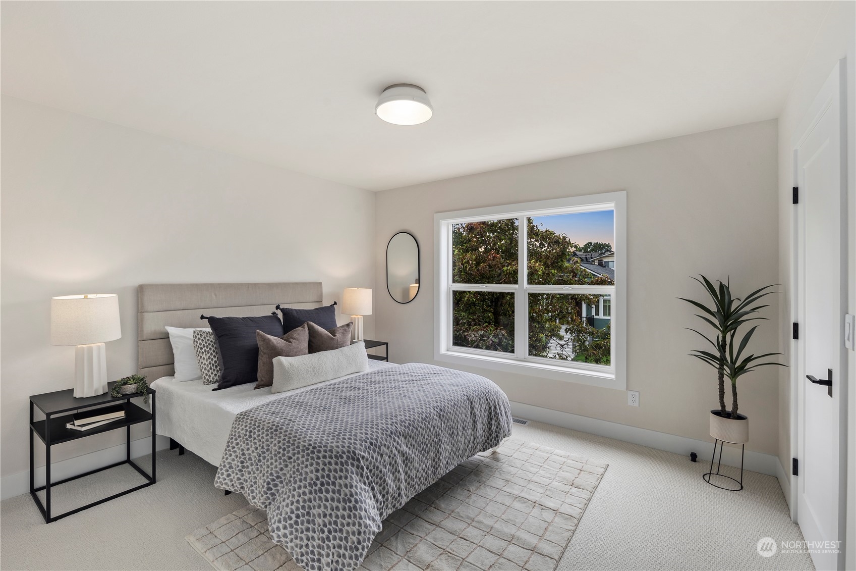 1722 26th Avenue South Seattle, WA 98144 - Photo 14 of 26 a bedroom with a large bed and a large window