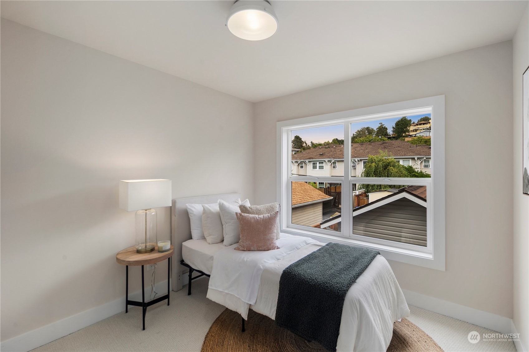 1722 26th Avenue South Seattle, WA 98144 - Photo 16 of 26 a bedroom with a bed and window