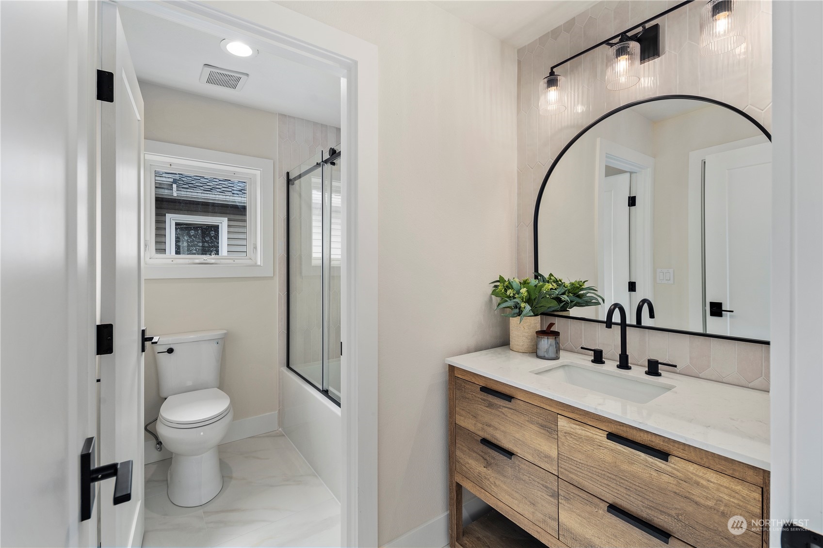 1722 26th Avenue South Seattle, WA 98144 - Photo 18 of 26 a bathroom with a sink a toilet and a mirror
